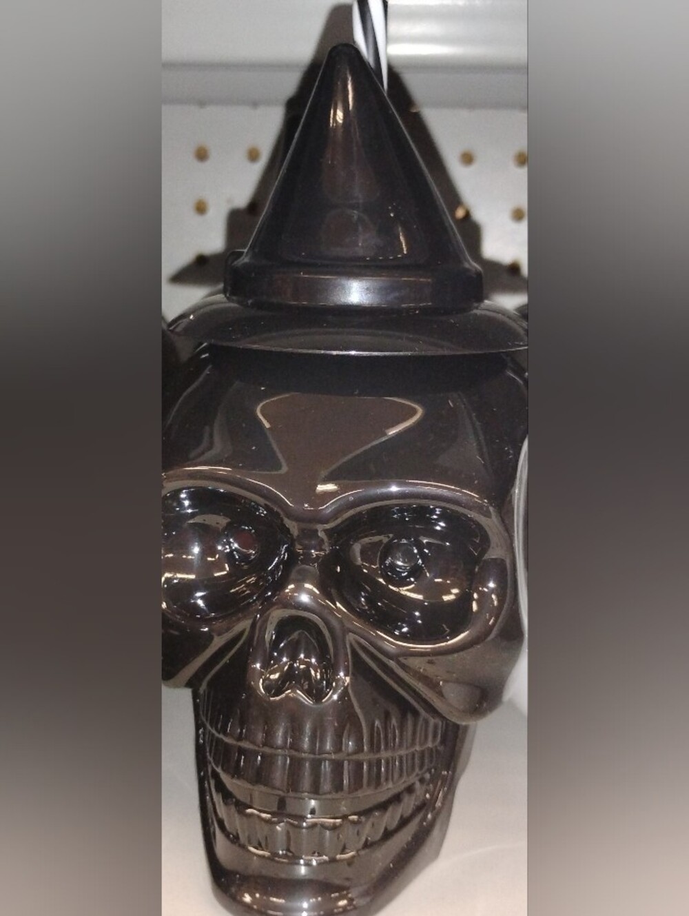 Black Skull-Shaped Bottle with a Witch Hat Lid & a Black & White Striped Straw